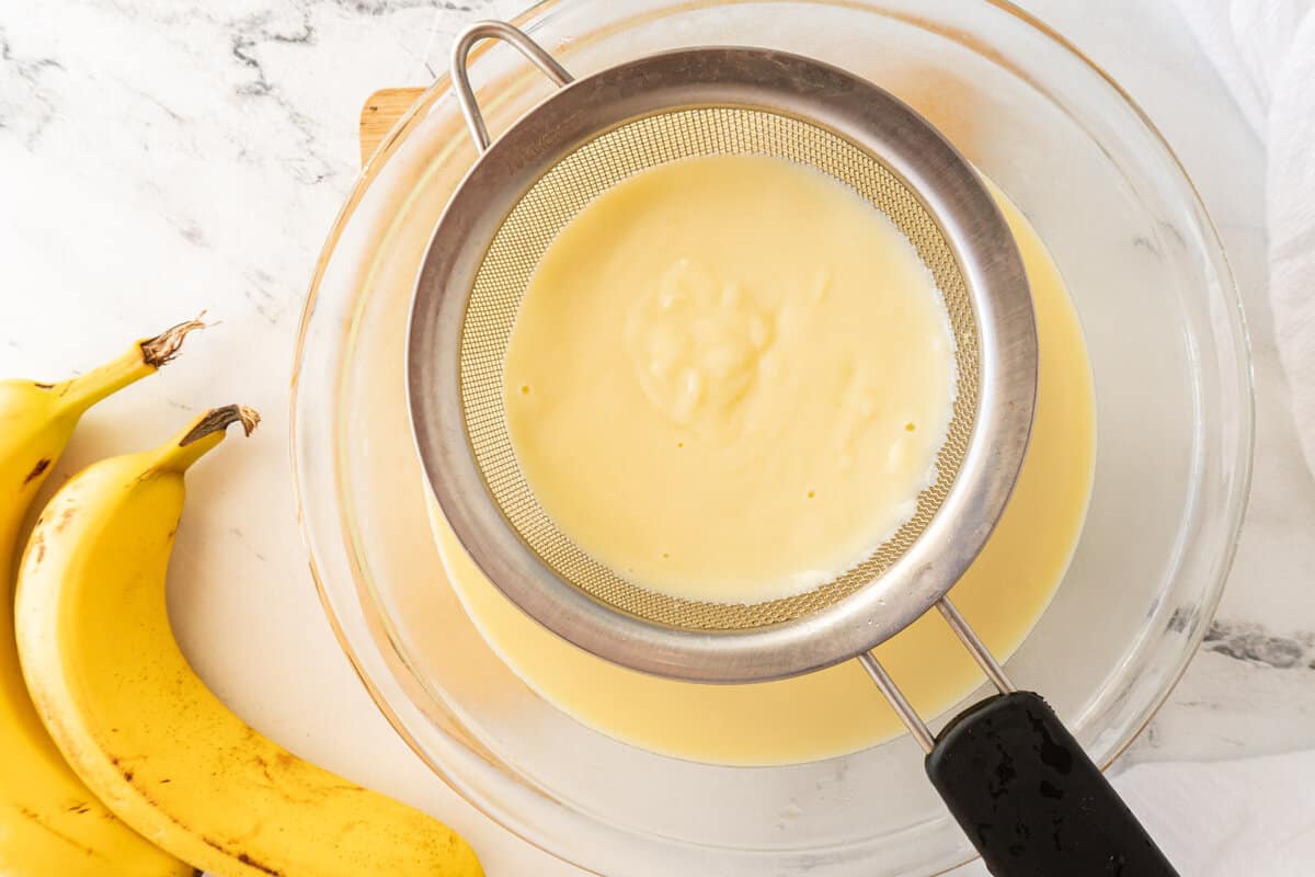 pouring budding through sieve