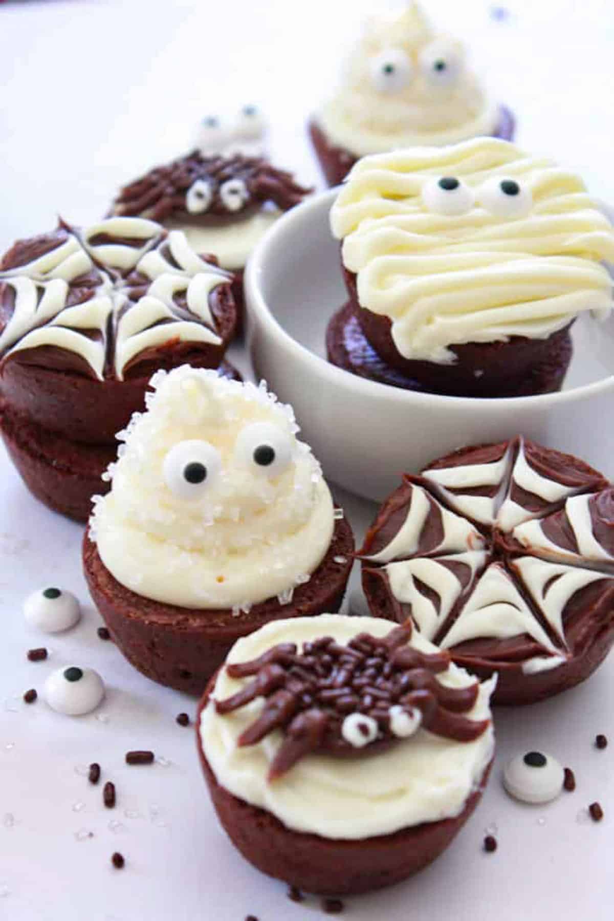 round brownies decorated as ghosts, spiders, and spider webs