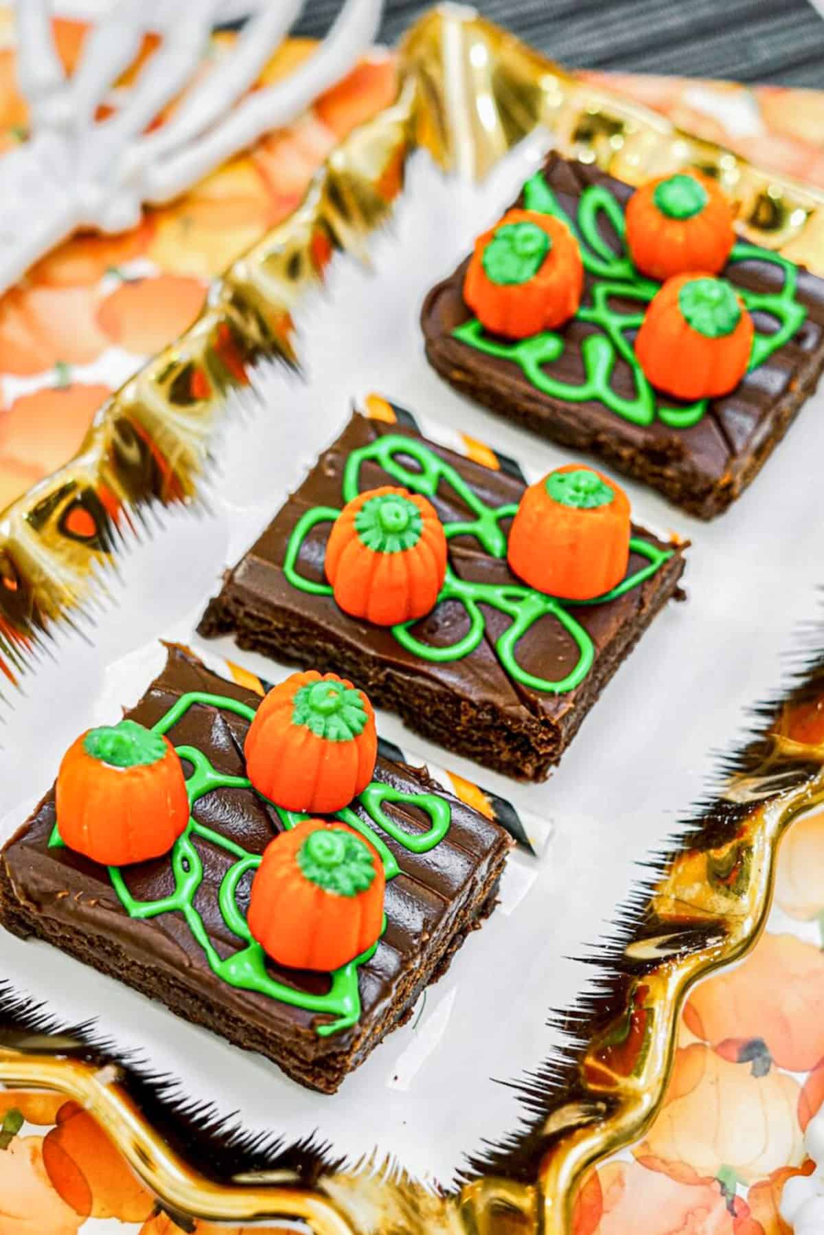 pumpkin patch brownies with green frosting and candy corn pumpkins