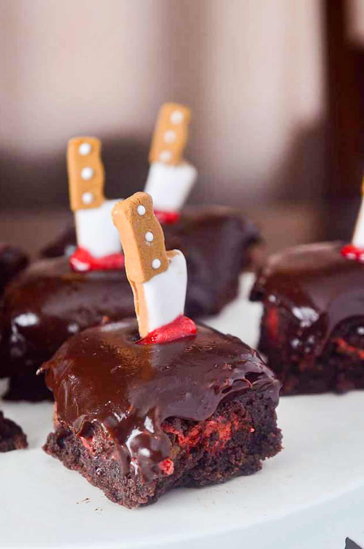 brownies with cookie knives stuck in them