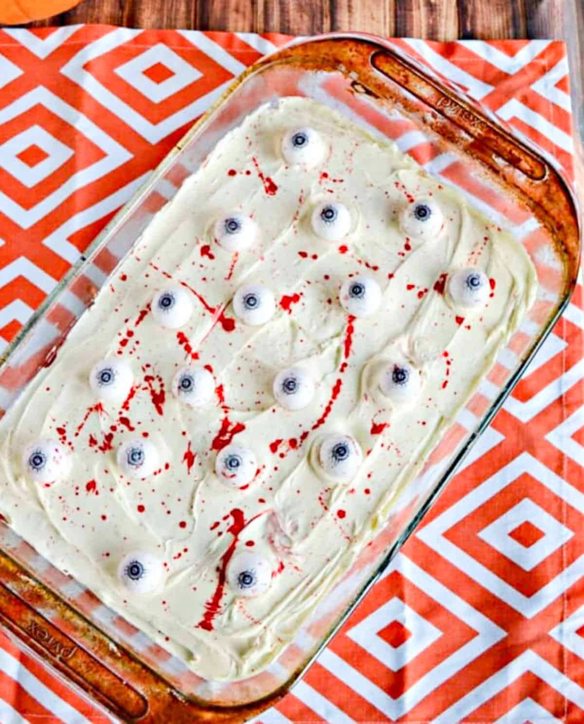 brownies with white frosting, large cadny eyes and fake blood slatter