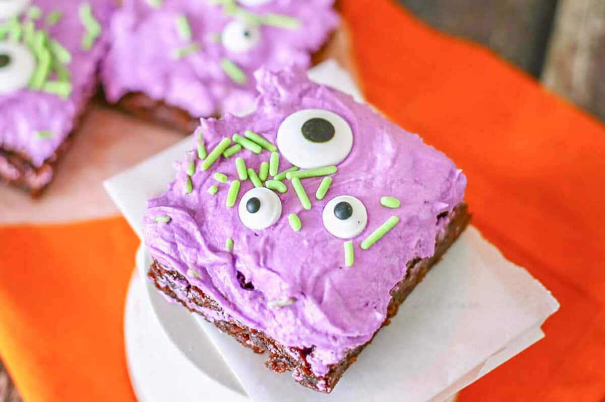 brownies with purple frosting and candy eyes