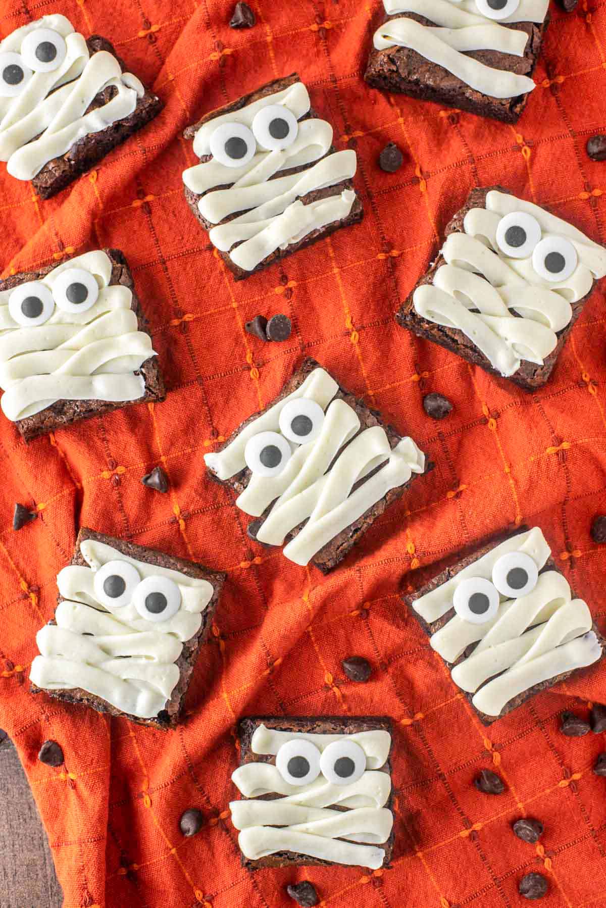 brownie squares with thick white frosting strips to look like mummy