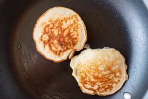 browned pancakes in pan