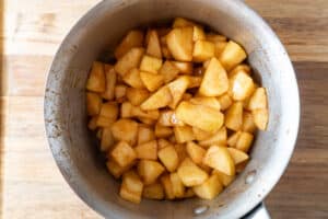 cooked apples in sauce pan