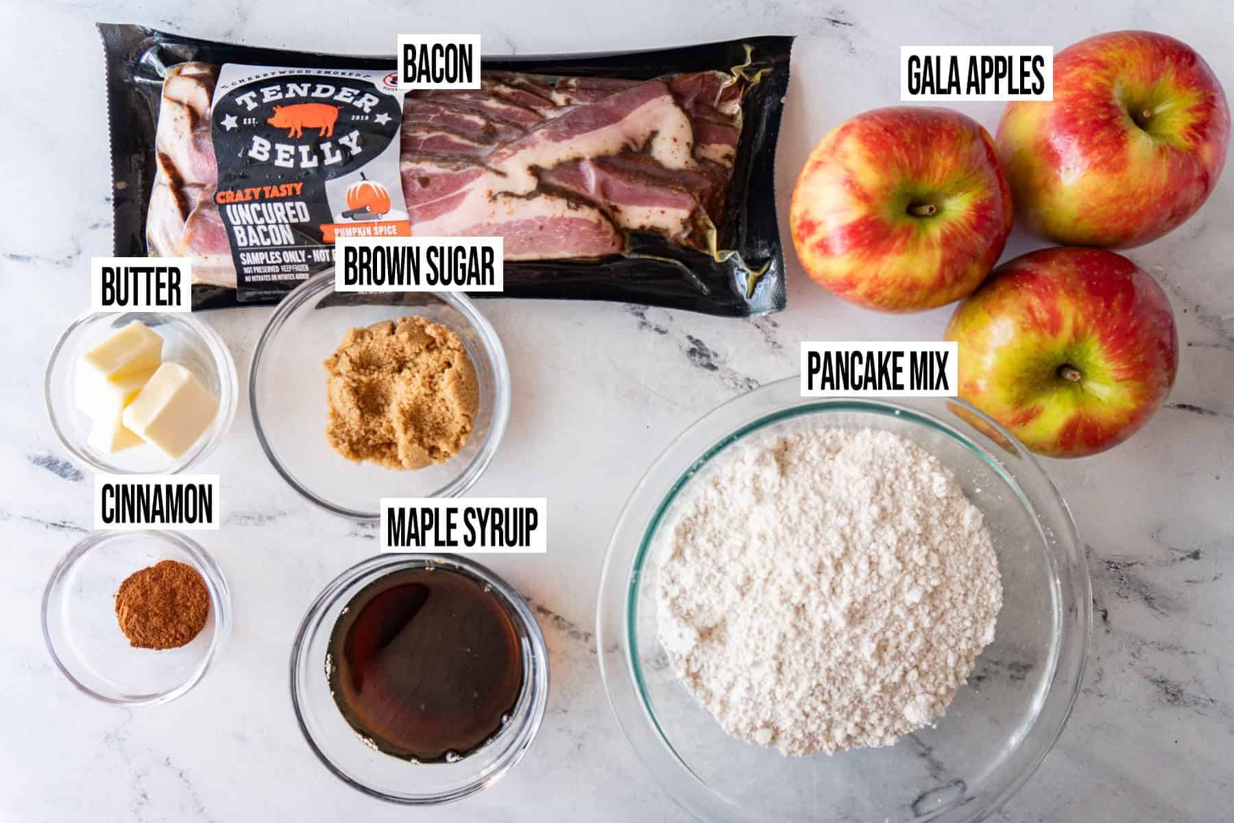Apple Bacon Pancakes ingredients are in individual bowls and labeled.