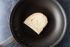 bread on fry pan, butter side down