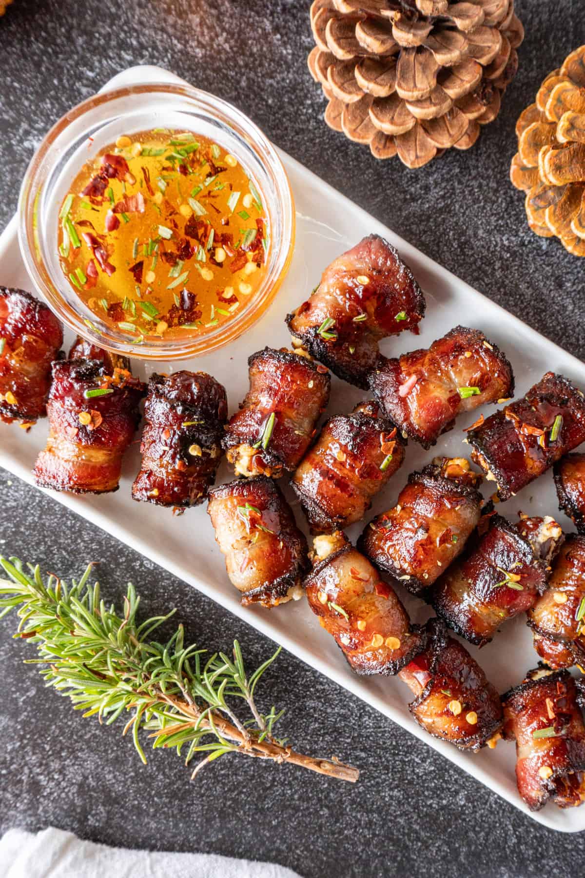 bacon wrapped dates with goat cheese on platter