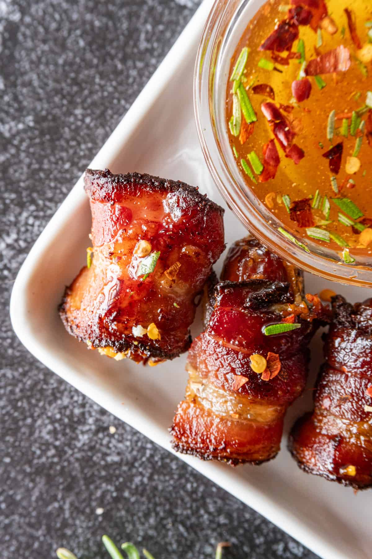 close up of bacon wrapped dates with goat cheese