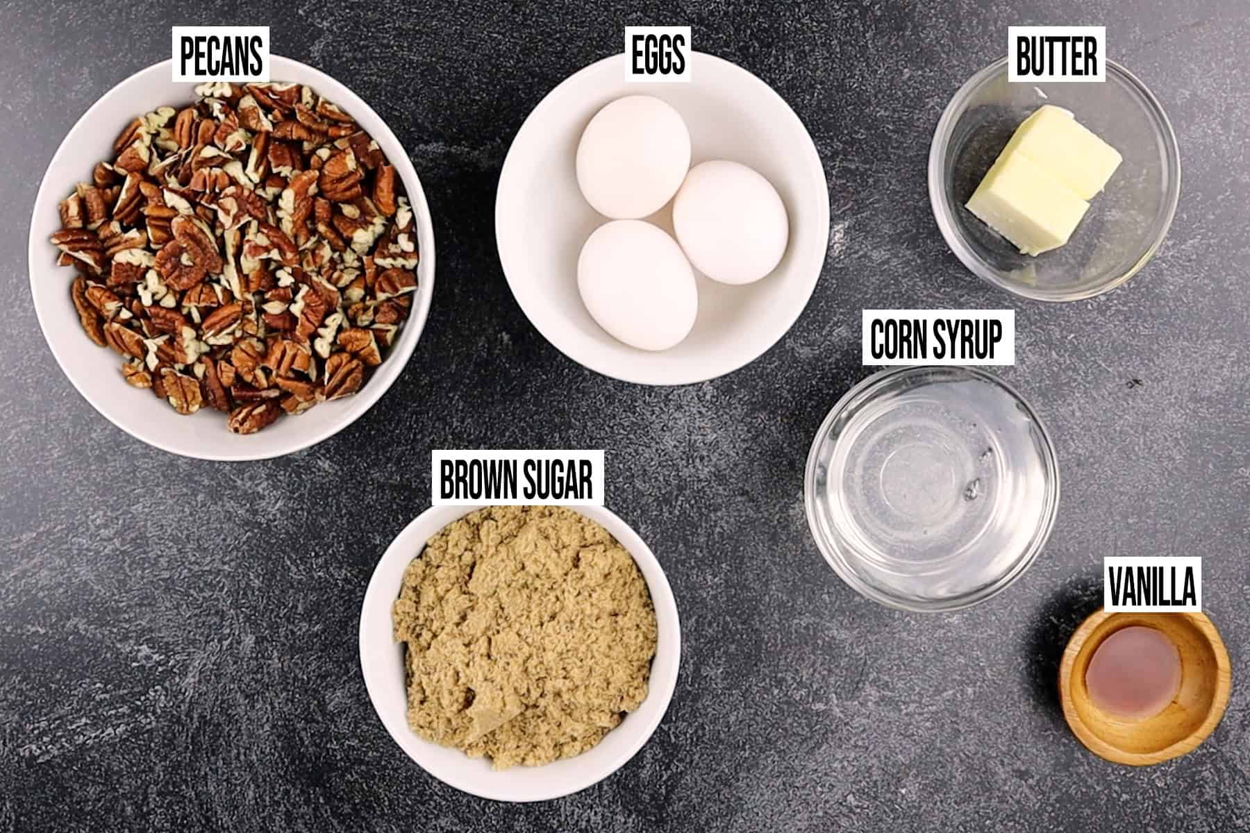 Pecan Pie Cake Topping Ingredients in individual bowls and labeled.