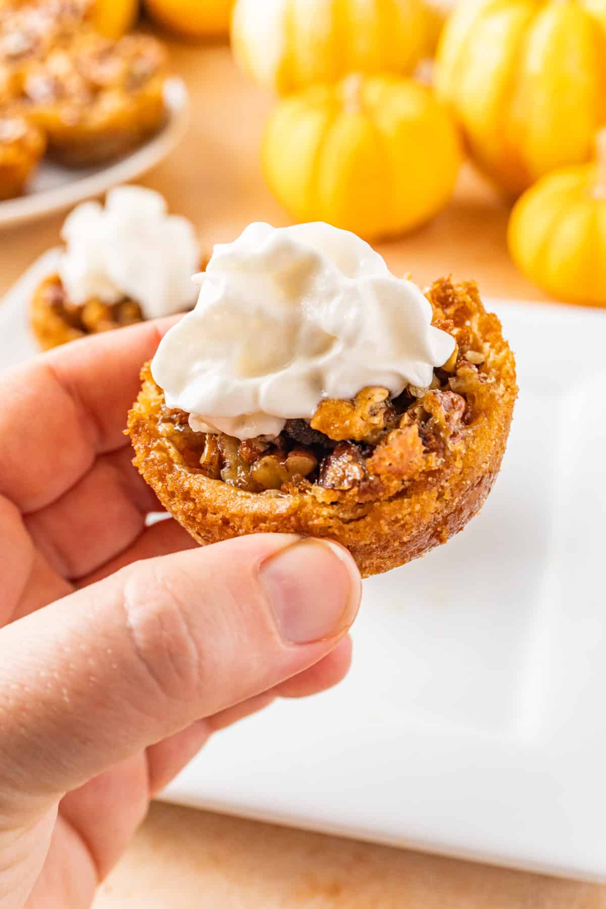 holding a pecan tart