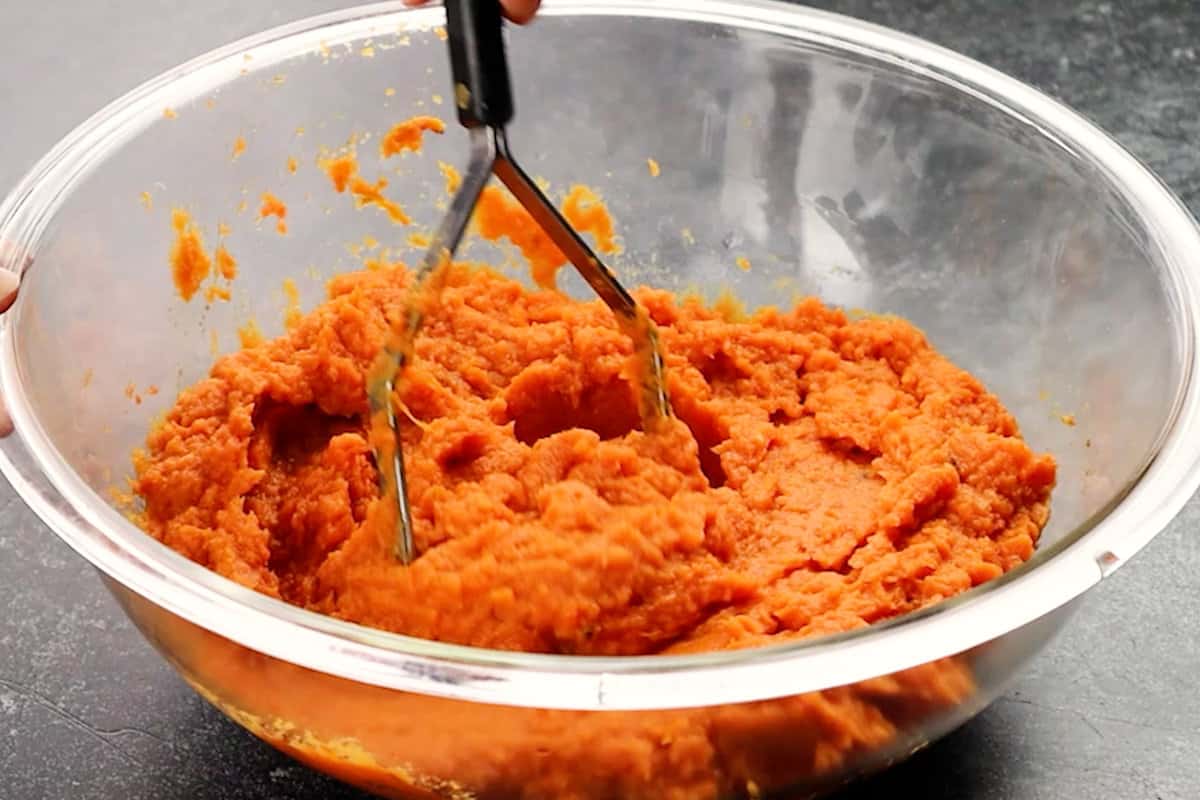 mashing sweet potatoes