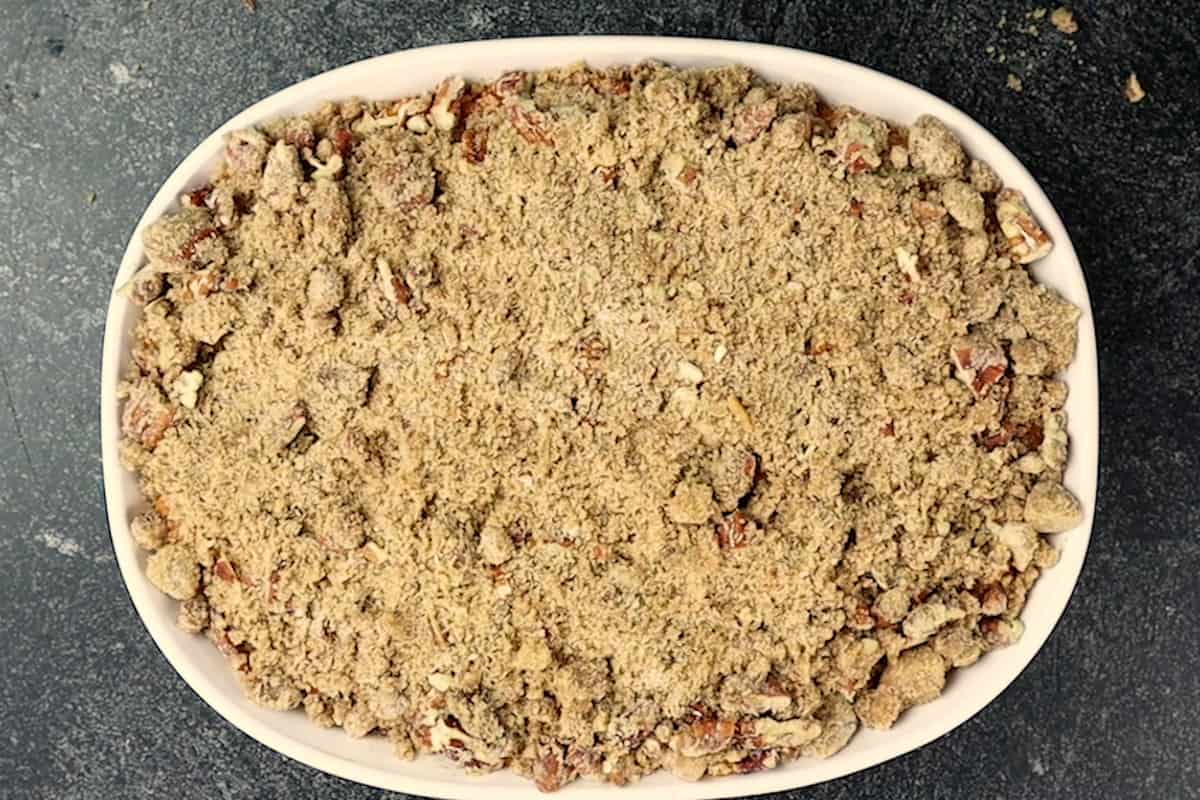 sweet potato souffle with topping in baking dish before being baked