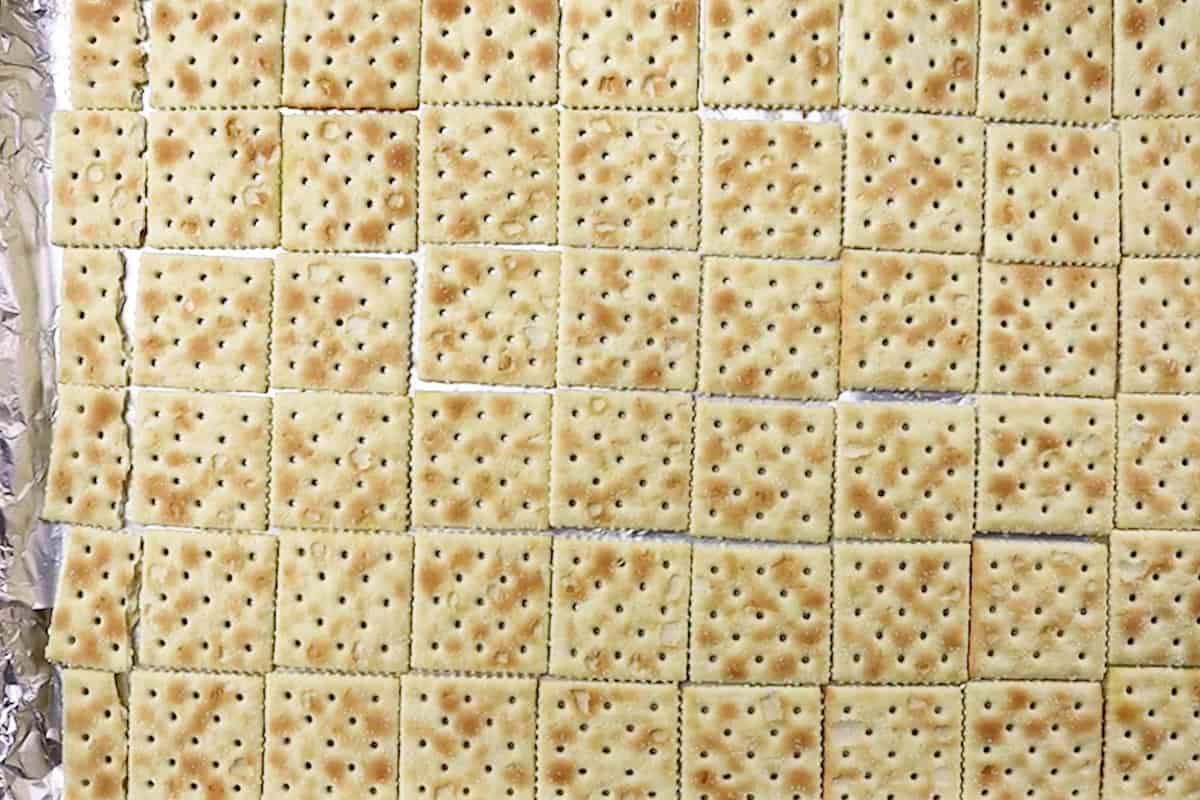 saltine crackers on baking sheet.