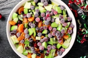 fruit salad with sugared cranberries added on top