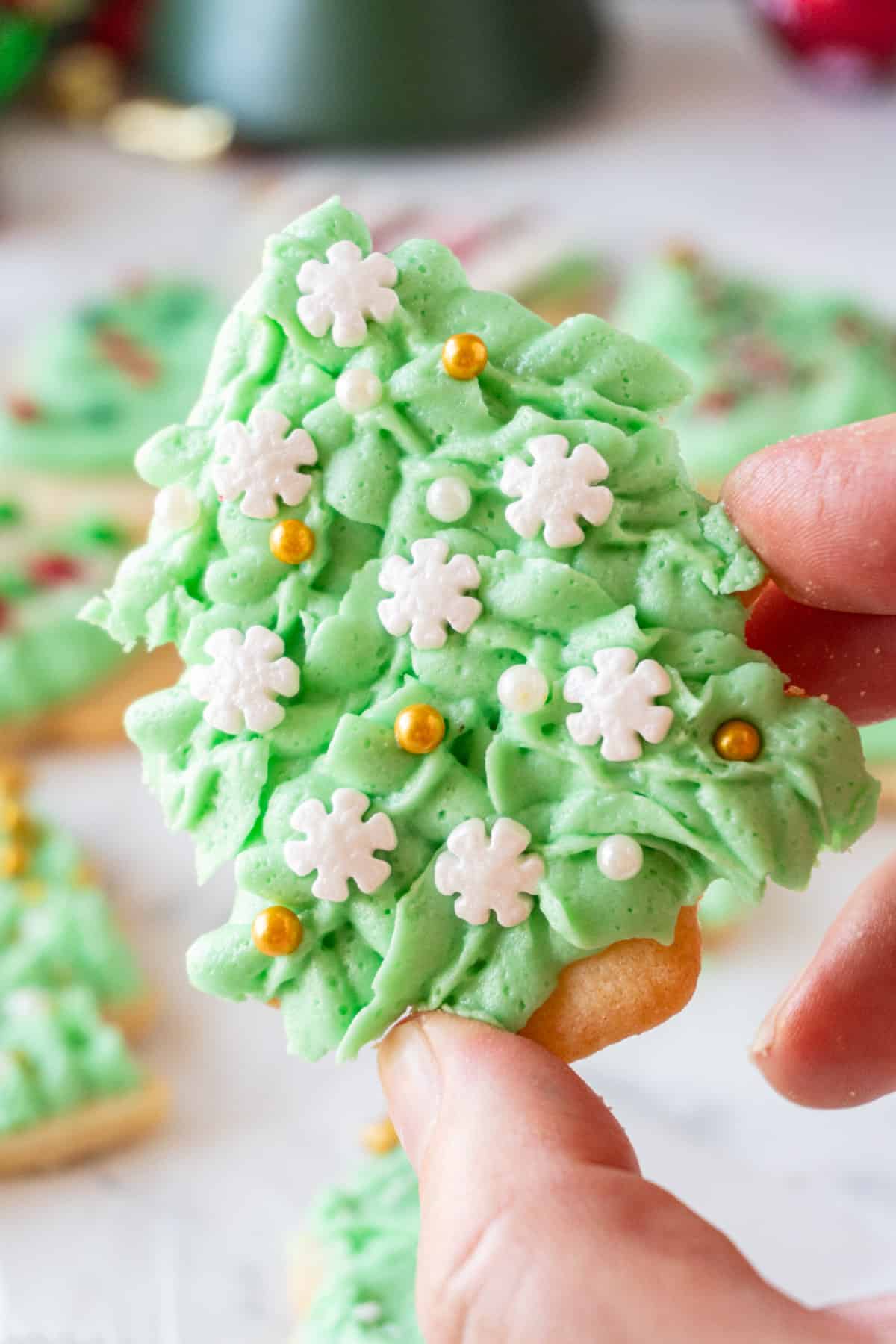 close up of Christmas Tree Cookie with snowflake sprinkles