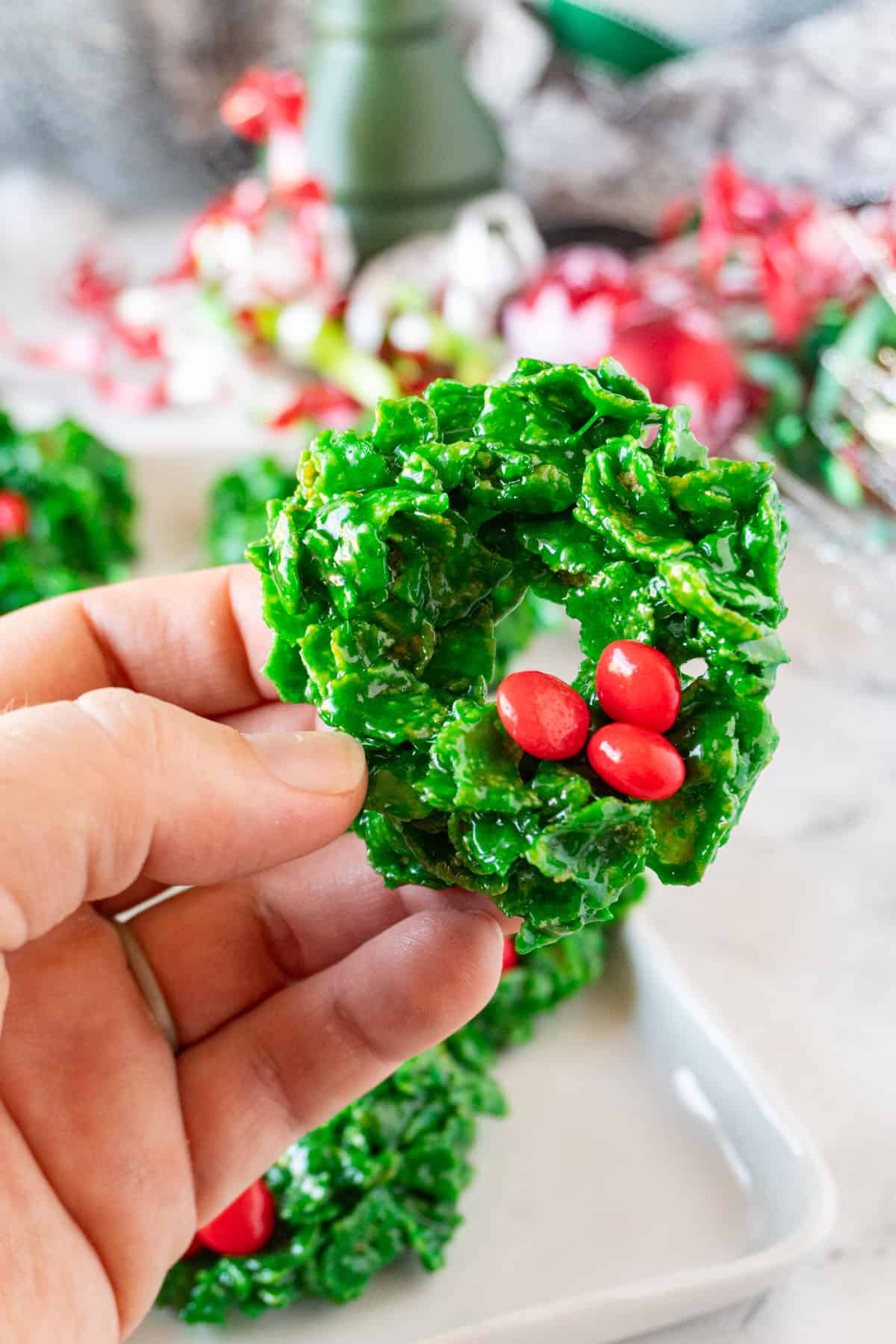 holding a Christmas Wreath Cookie