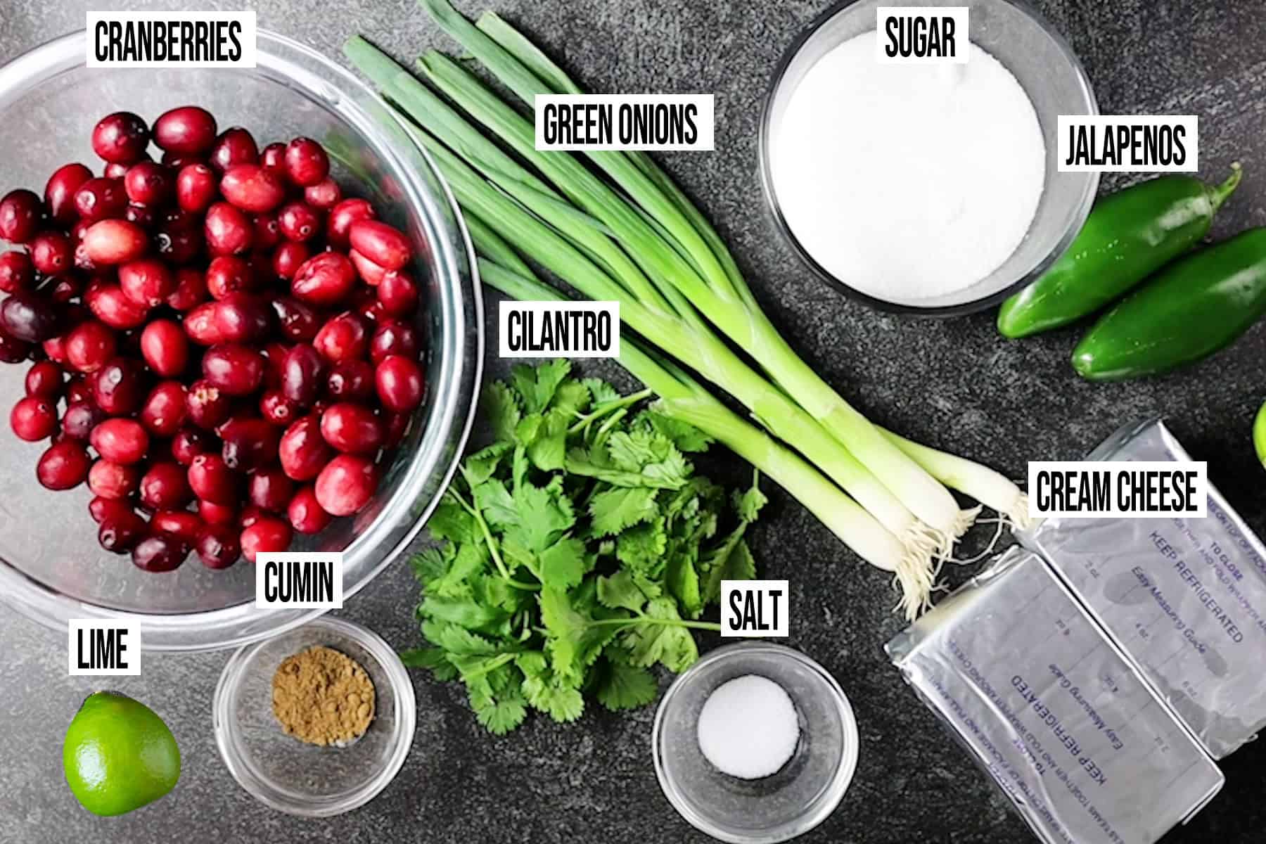 cranberry jalapeno cream cheese dip ingredients in individual bowls and labeled.
