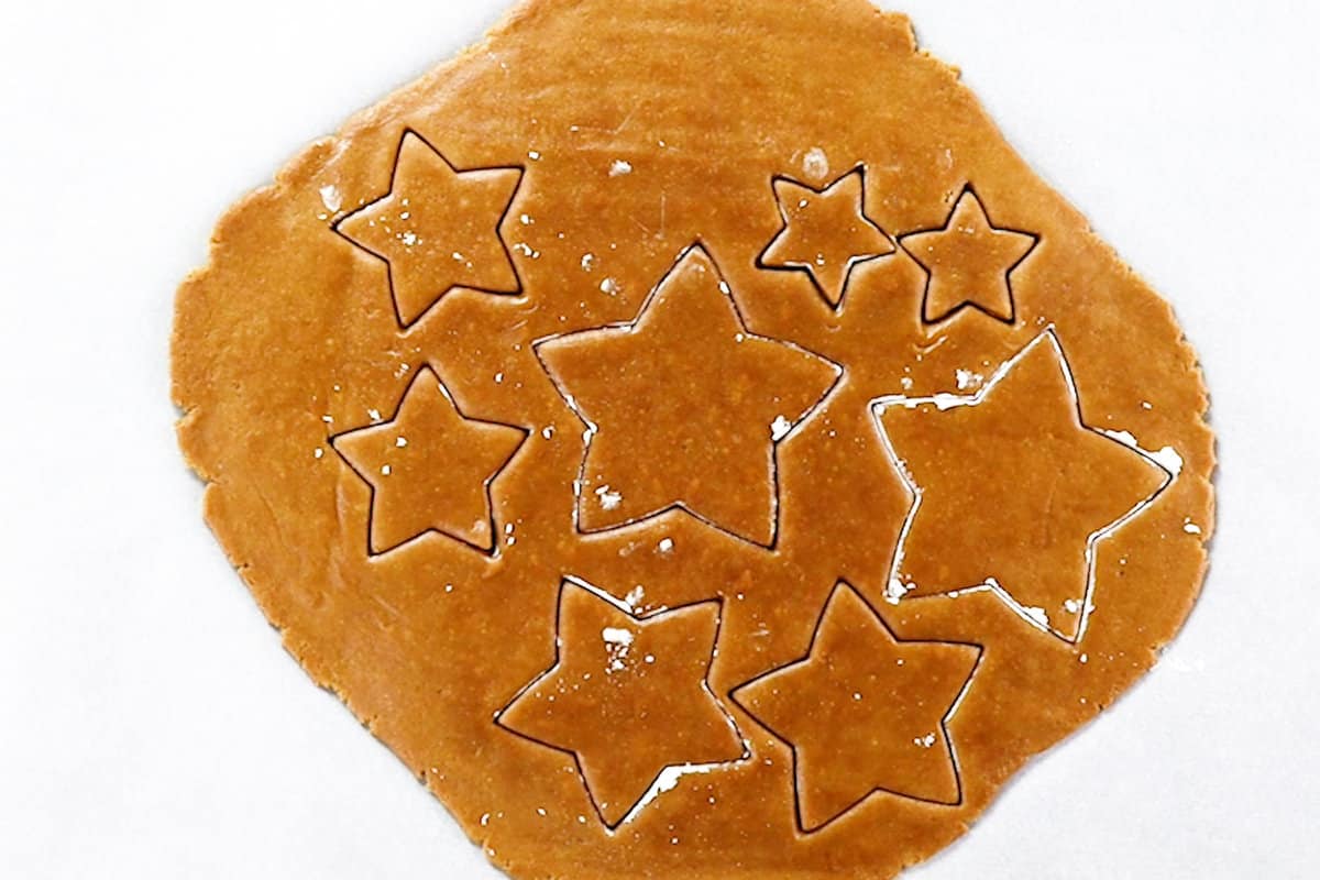 cutting stars out of cookie dough