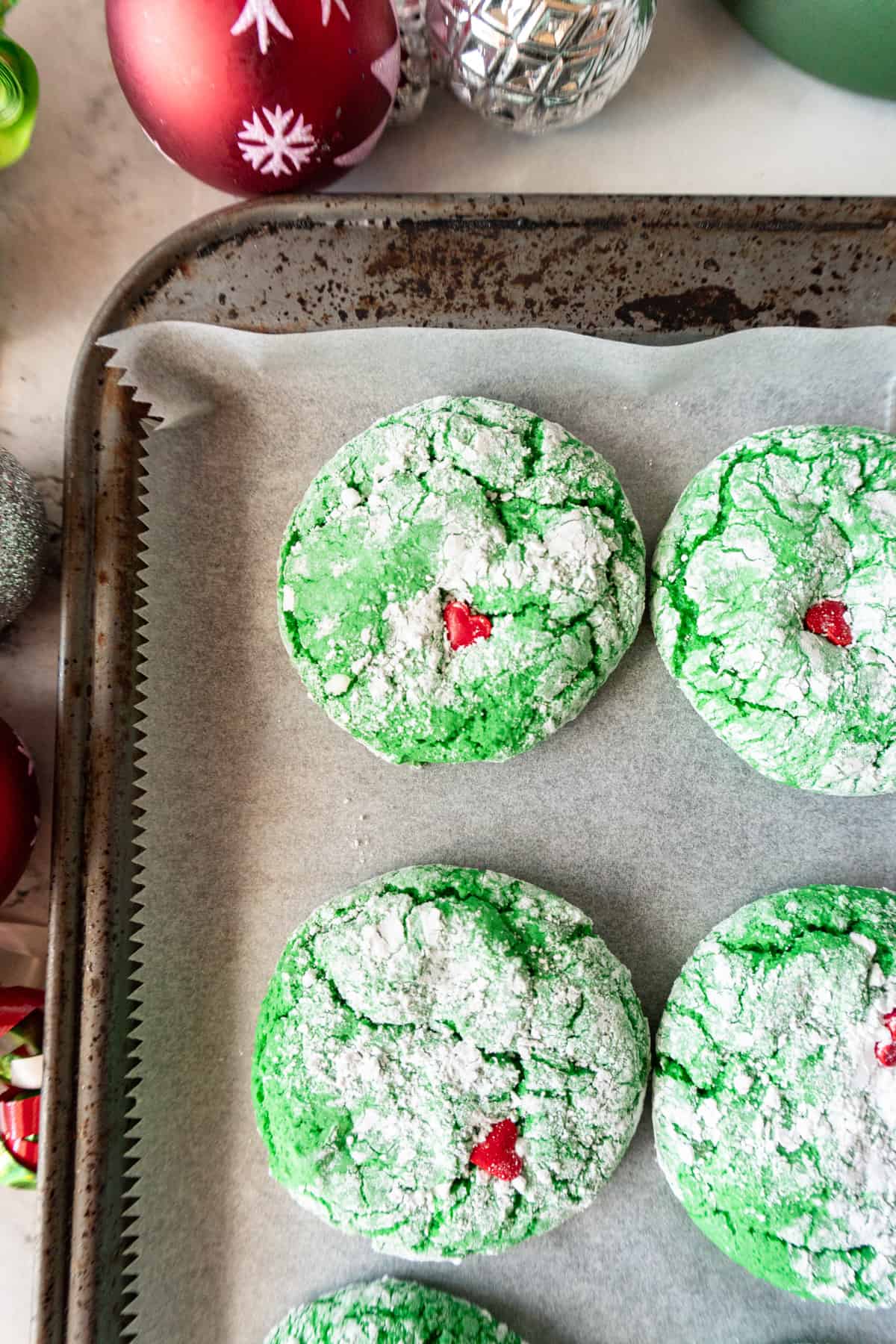 close up of Grinch Cookie on baking sheet