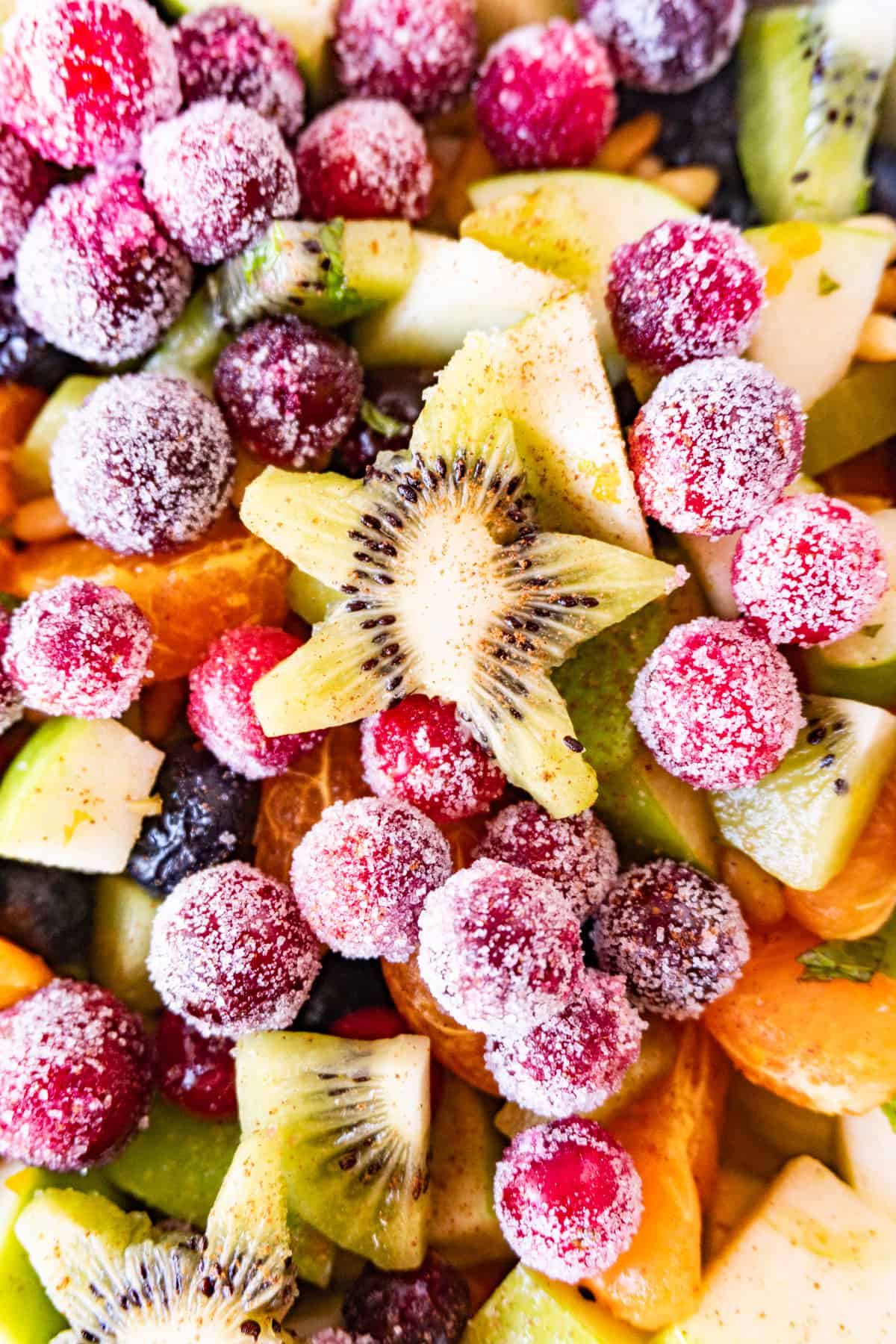 close up of cut out kiwi star in fruit salad