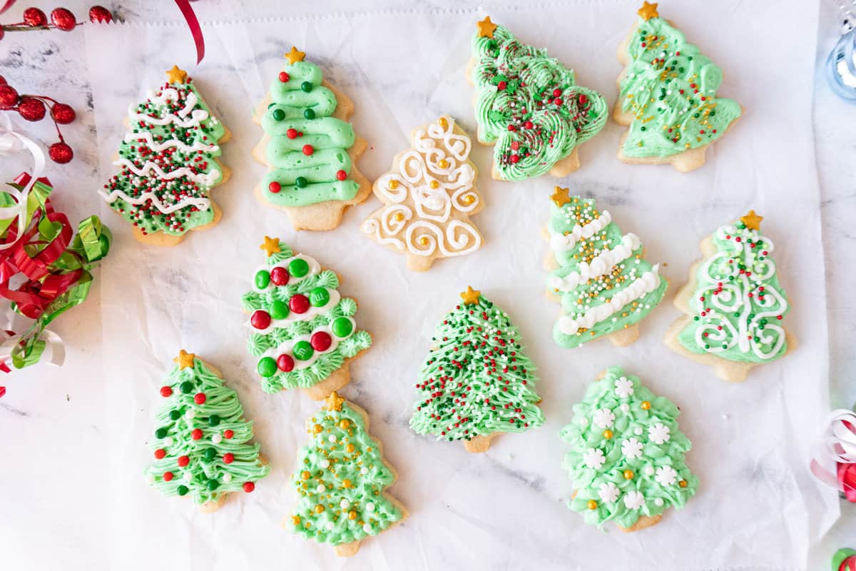 variety of Christmas tree cookies laid out