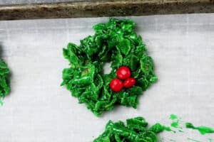 red candy added to wreath