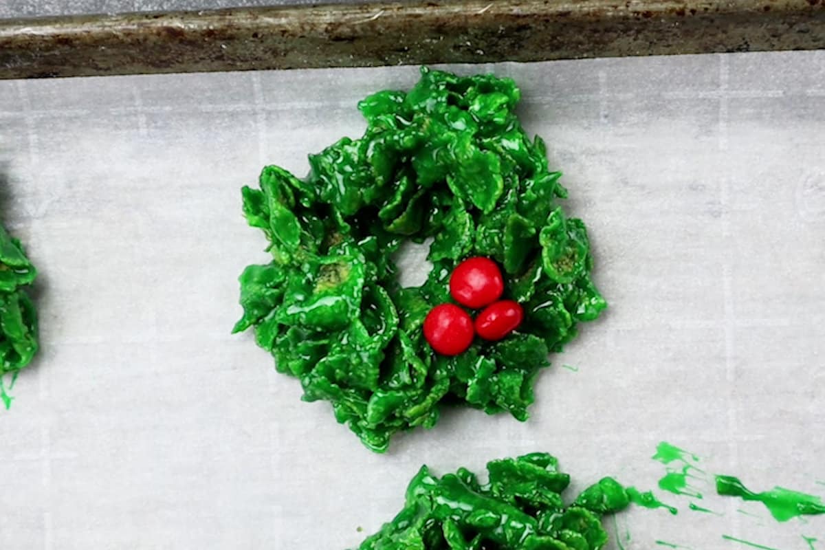 red candy added to wreath