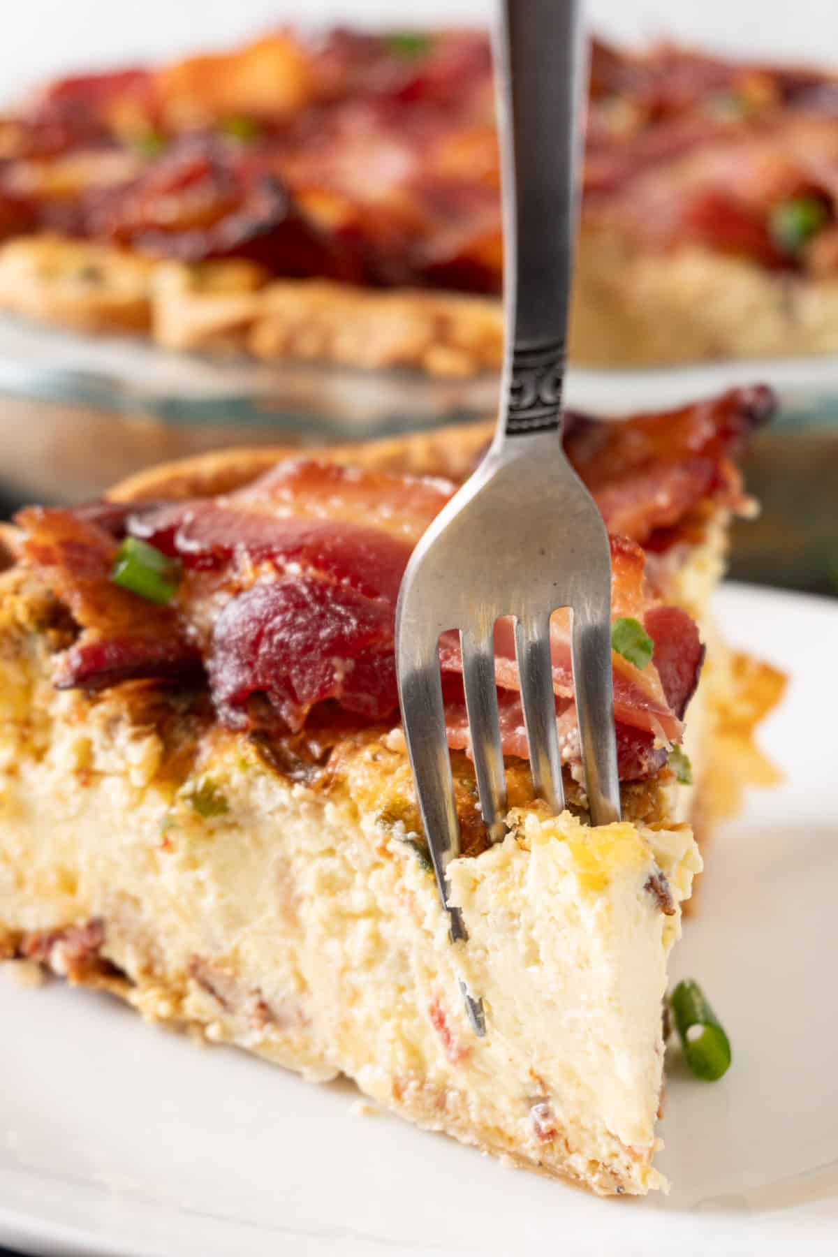 fork taking a piece out of slice of pie