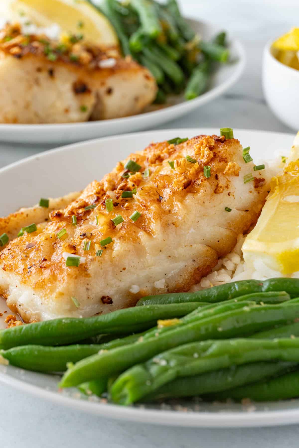 Pan Fried Cod on plate with green beans