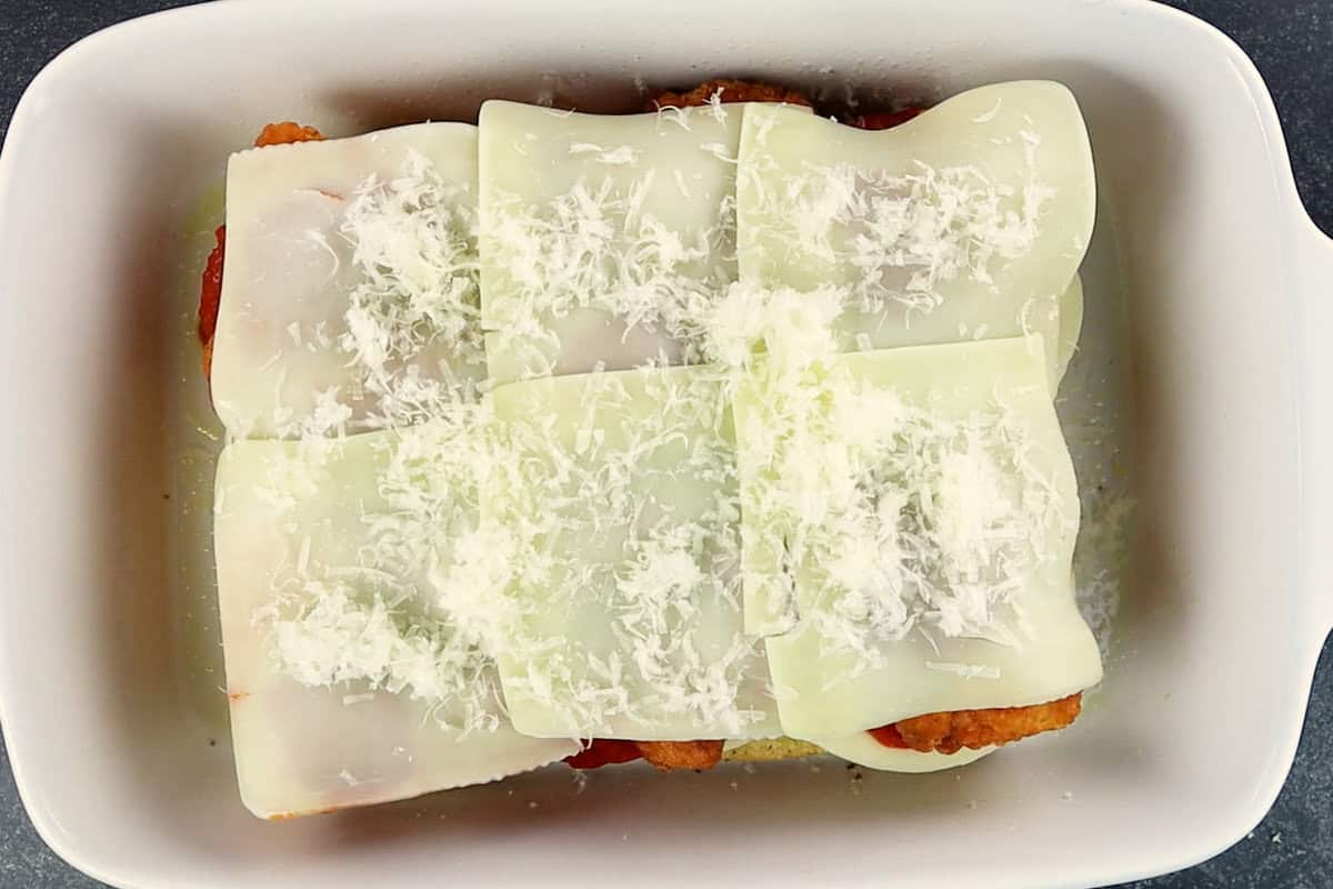 topping nuggets with mozzarella and parmesan