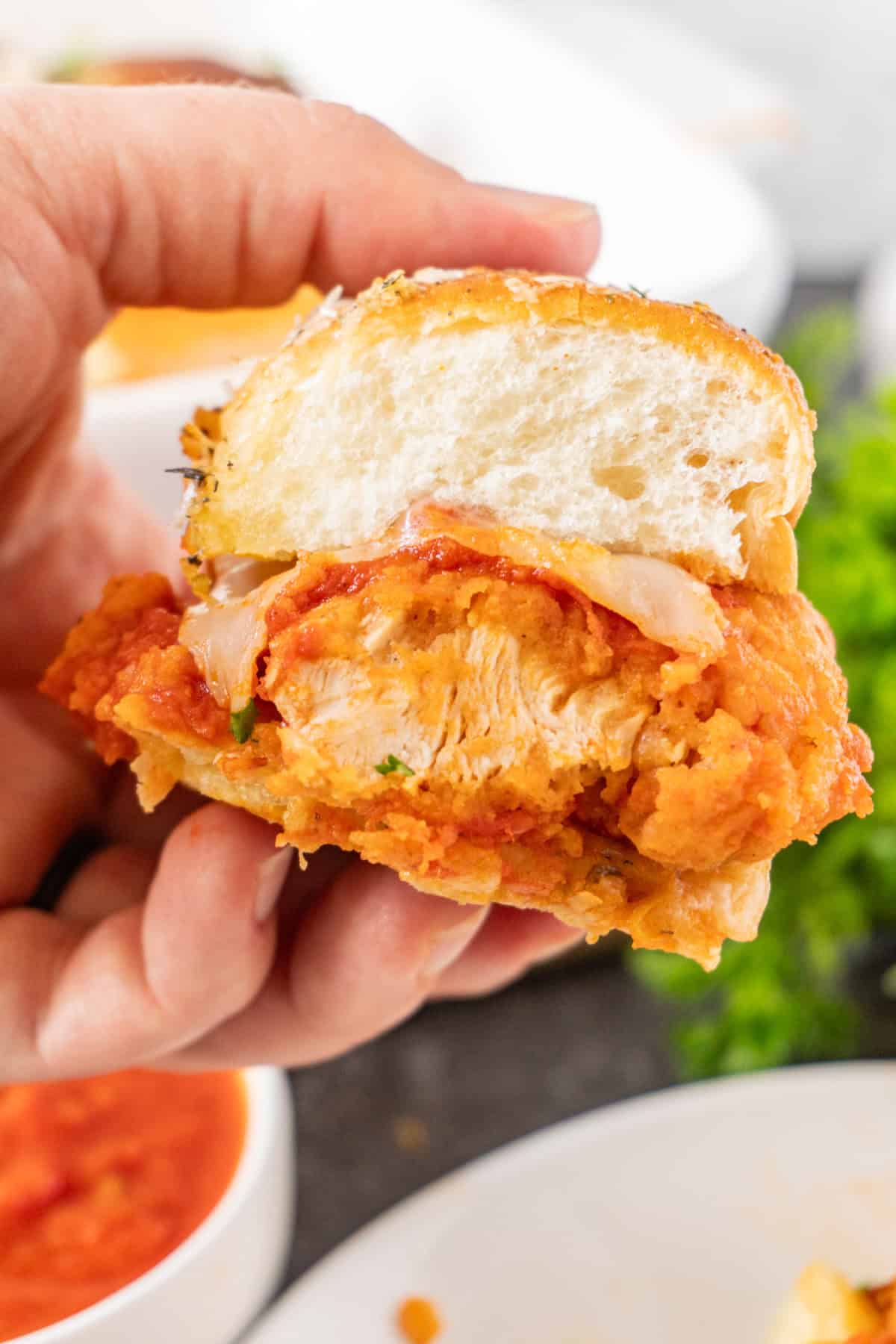 holding a slider in hand