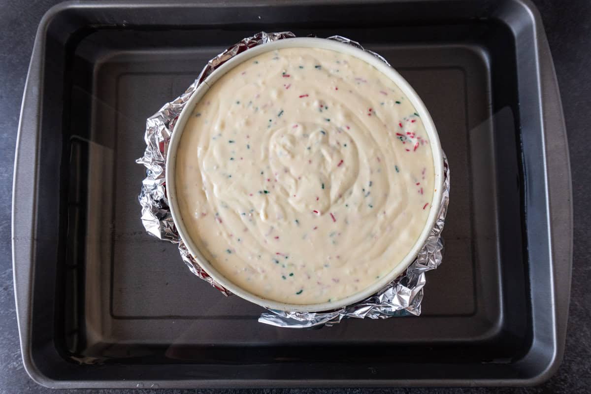 unbaked cheesecake in water bath