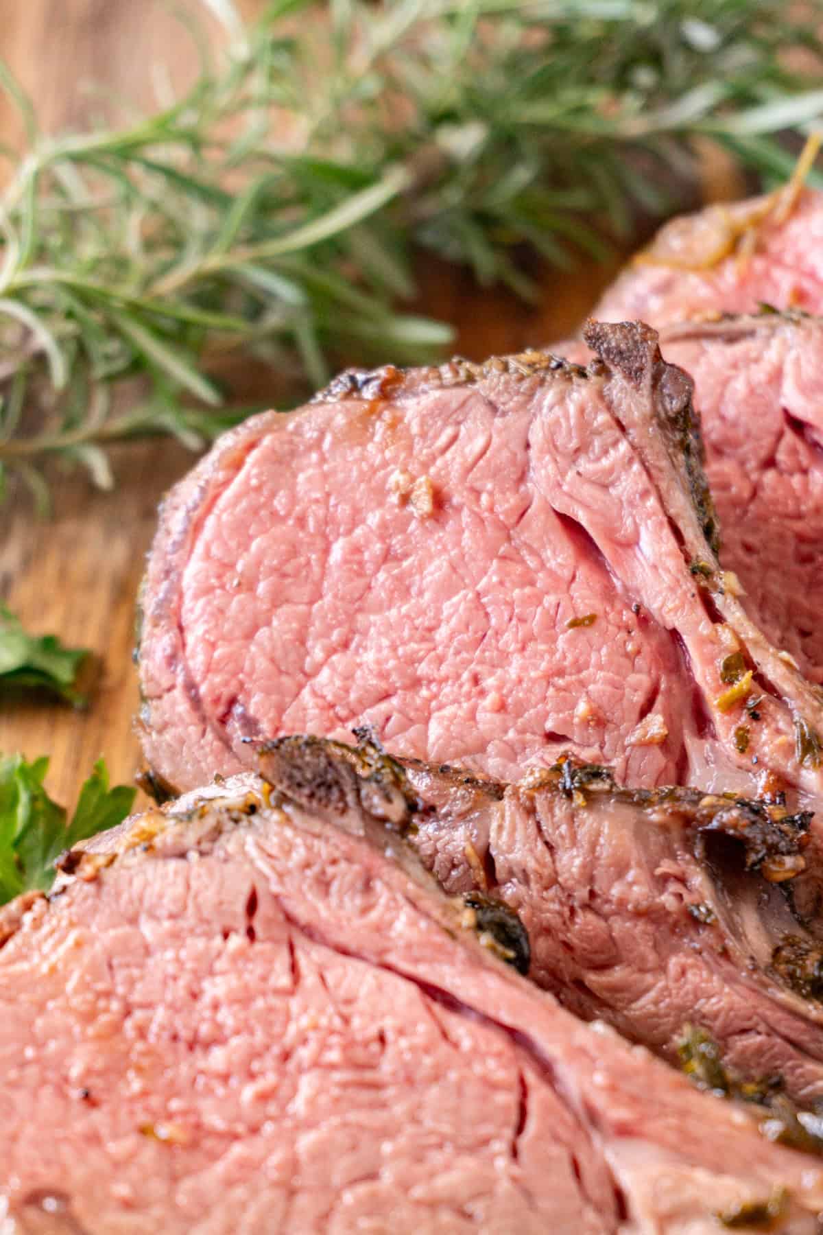 Herb Crusted Rack of Lamb slice showing pink medium-rare meat.