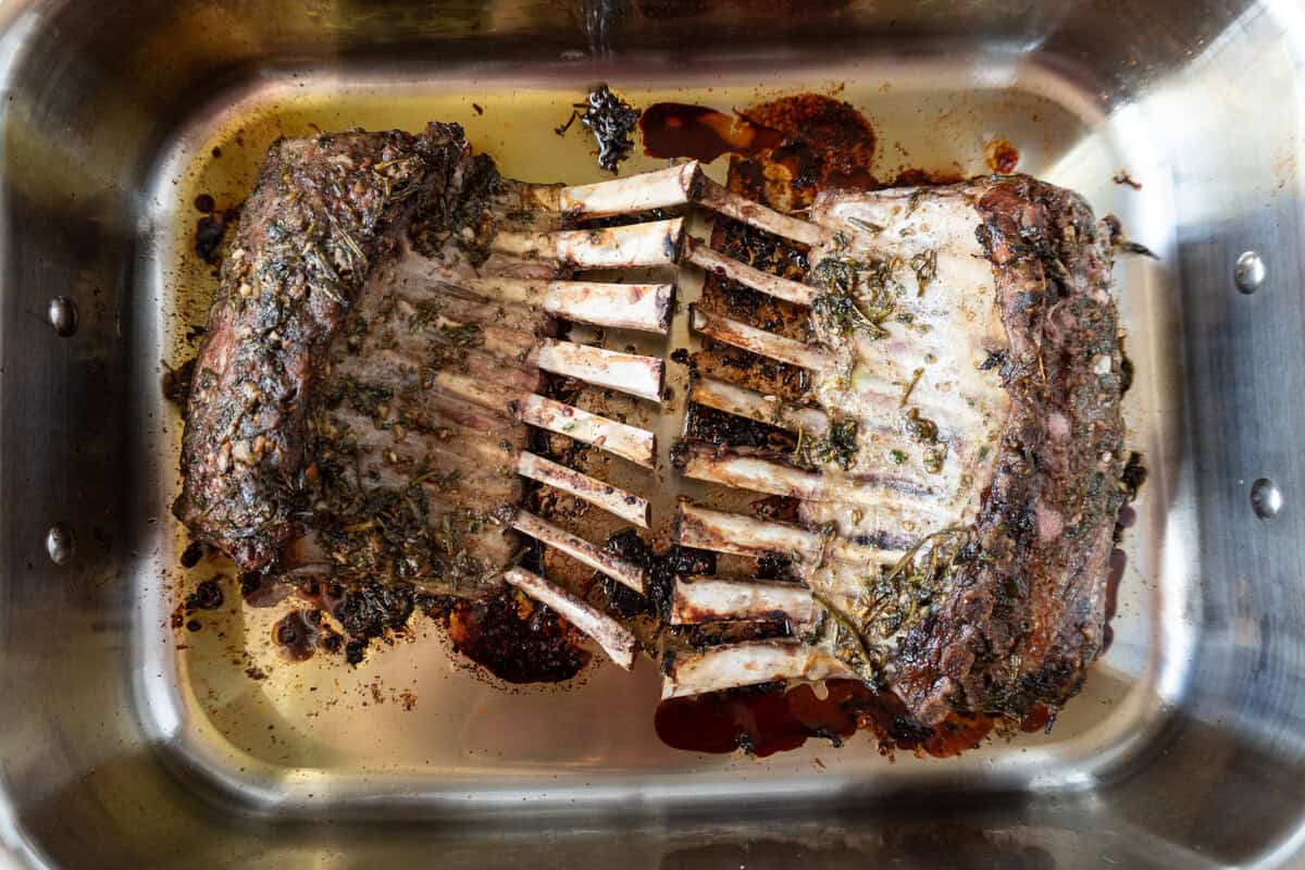 baked Herb Crusted Rack of Lamb in roasting pan.