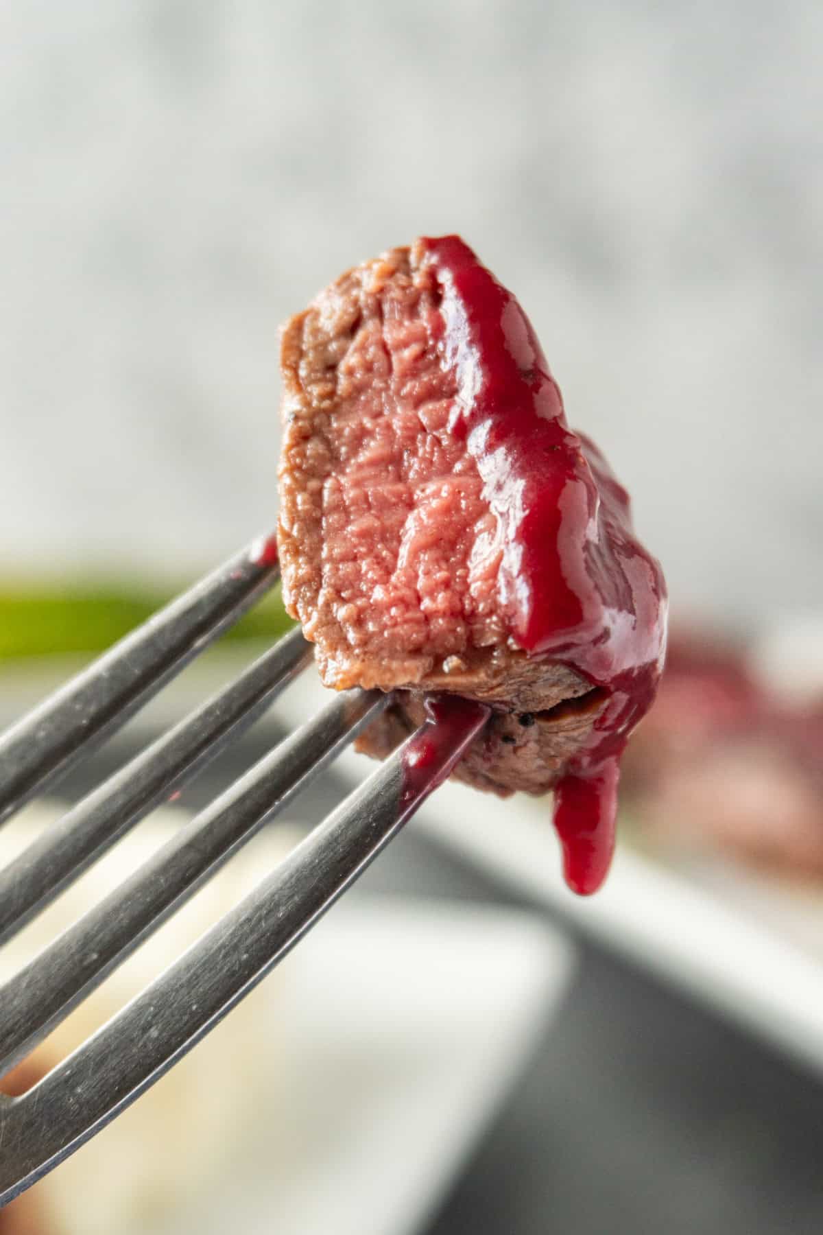 filet medallion on fork.