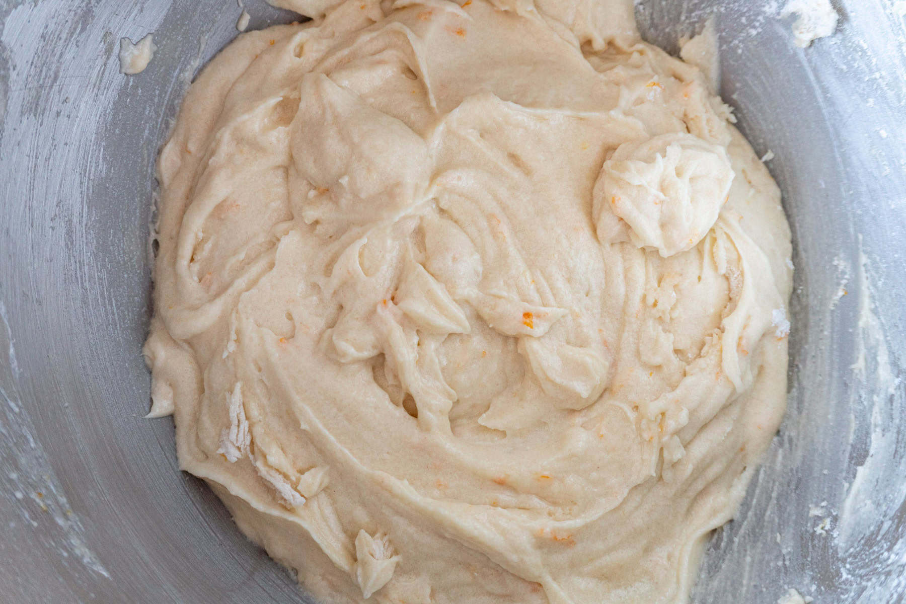 Orange cupcake batter mixed bowl.