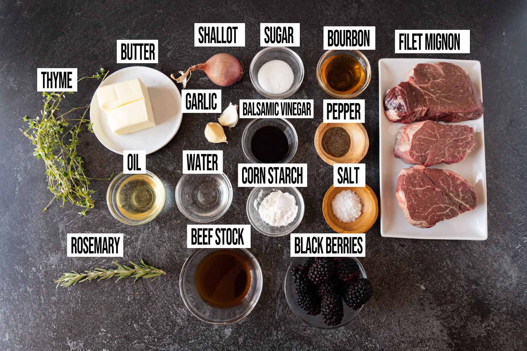 Filet medallions with blackberry sauce ingredients laid out and in individual bowls and labeled.