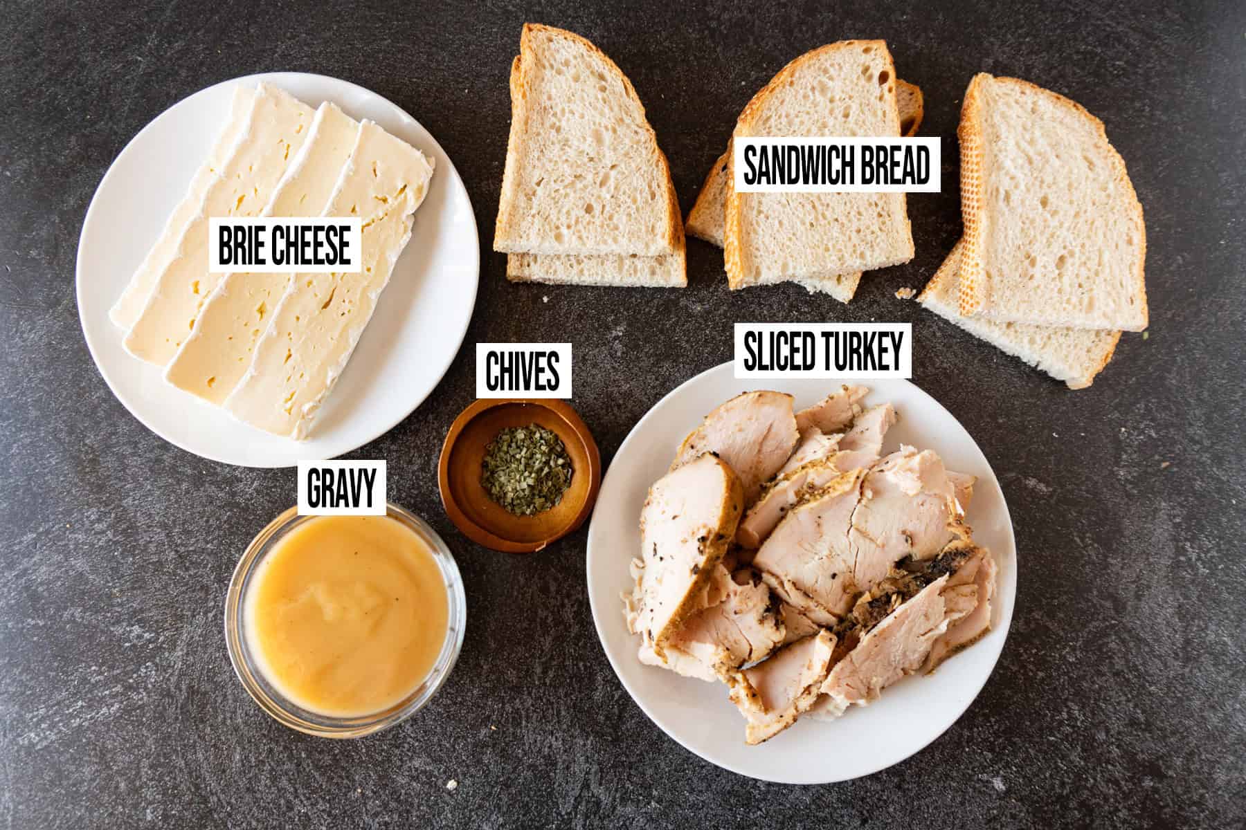 Hot Open Faced Turkey Sandwiches ingredients laid out and in individual bowls and labeled.