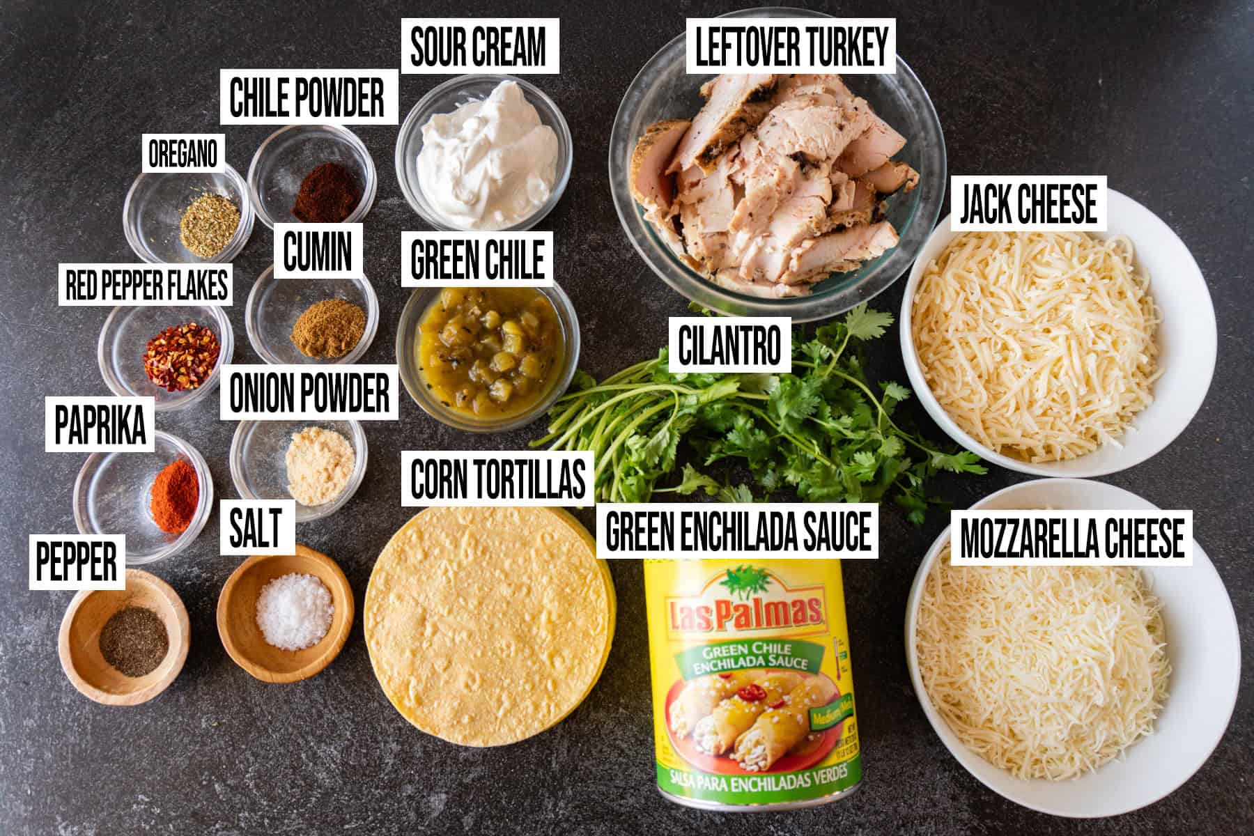 Leftover Thanksgiving Turkey Enchiladas ingredients laid out and in individual bowls and labeled.