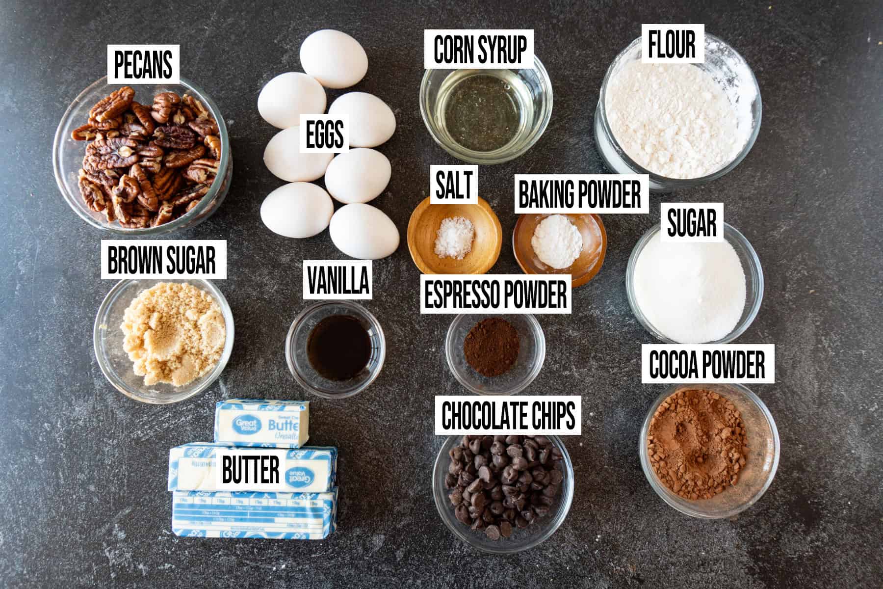Pecan Pie Brownies ingredients laid out and in individual bowls and labeled.