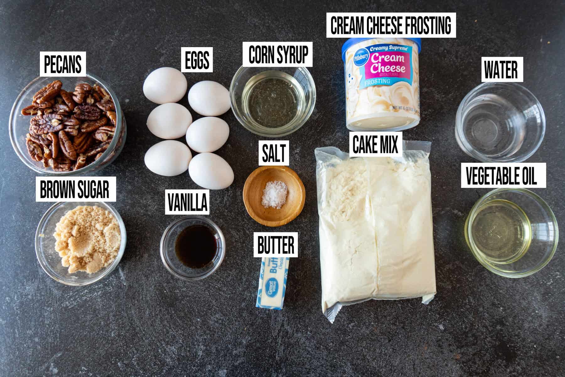 Pecan Pie Cake ingredients laid out and in individual bowls and labeled.