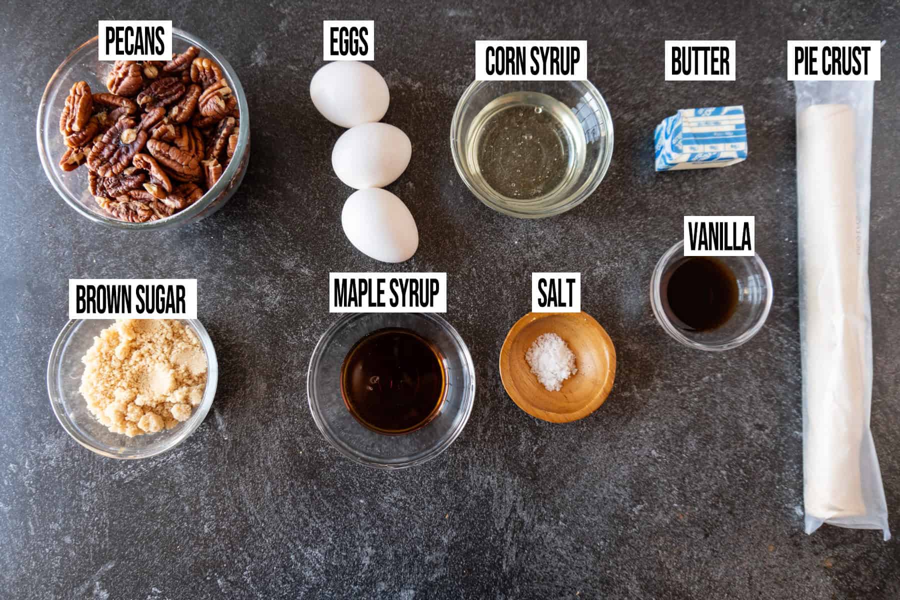 Pecan Pie ingredients laid out and in individual bowls and labeled.