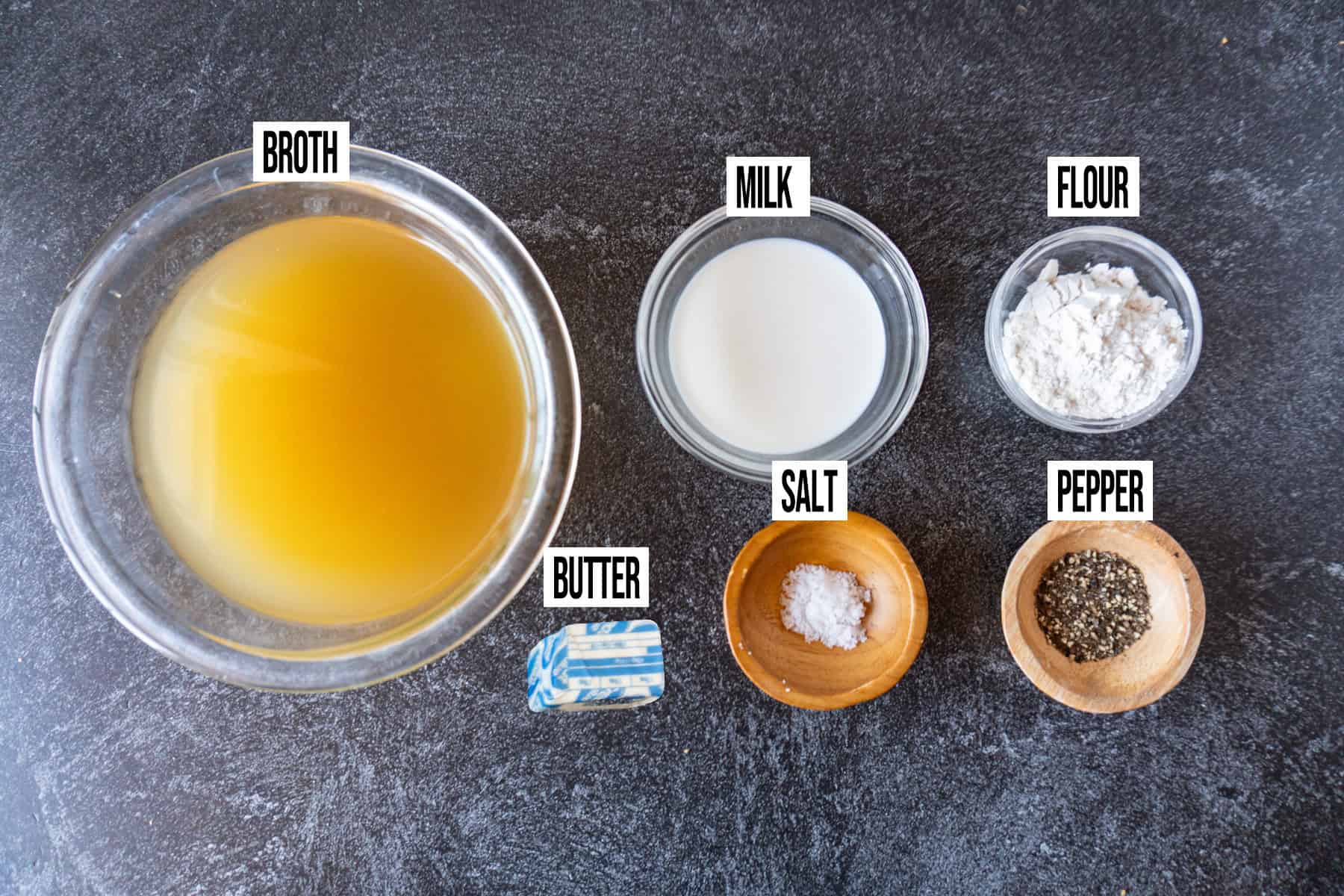Pepper Gravy ingredients laid out and in individual bowls and labeled.