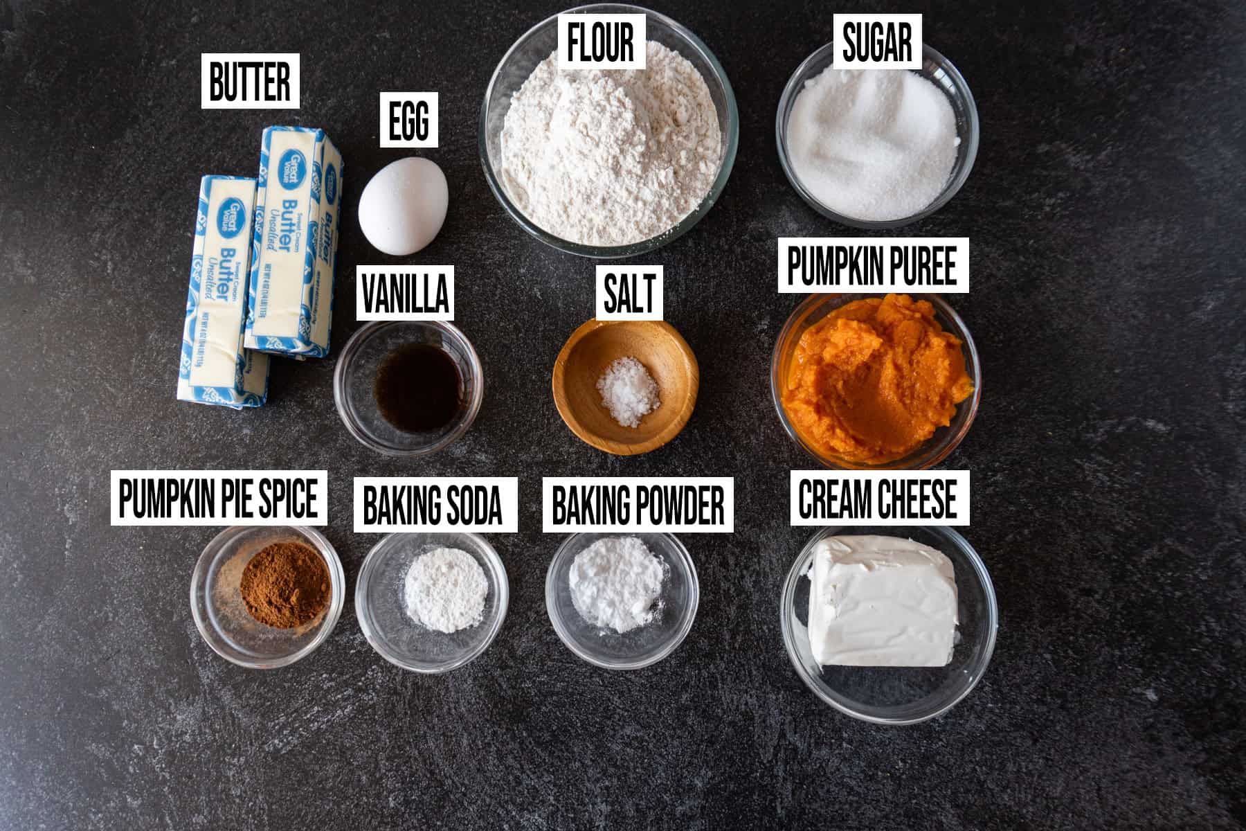 Pumpkin Cheesecake Cookies ingredients laid out and in individual bowls and labeled.