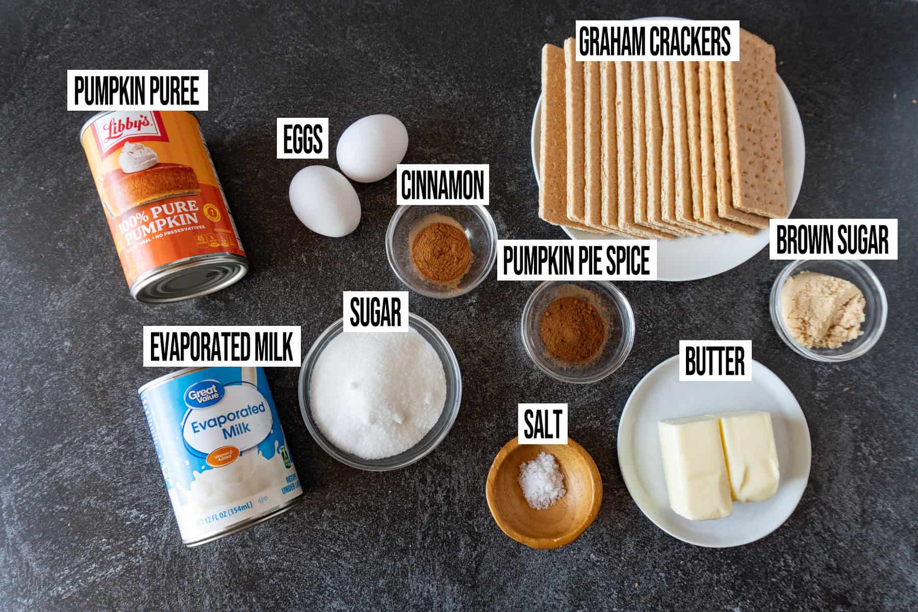 Pumpkin Pie with Graham Cracker Crust ingredients laid out and in individual bowls and labeled.