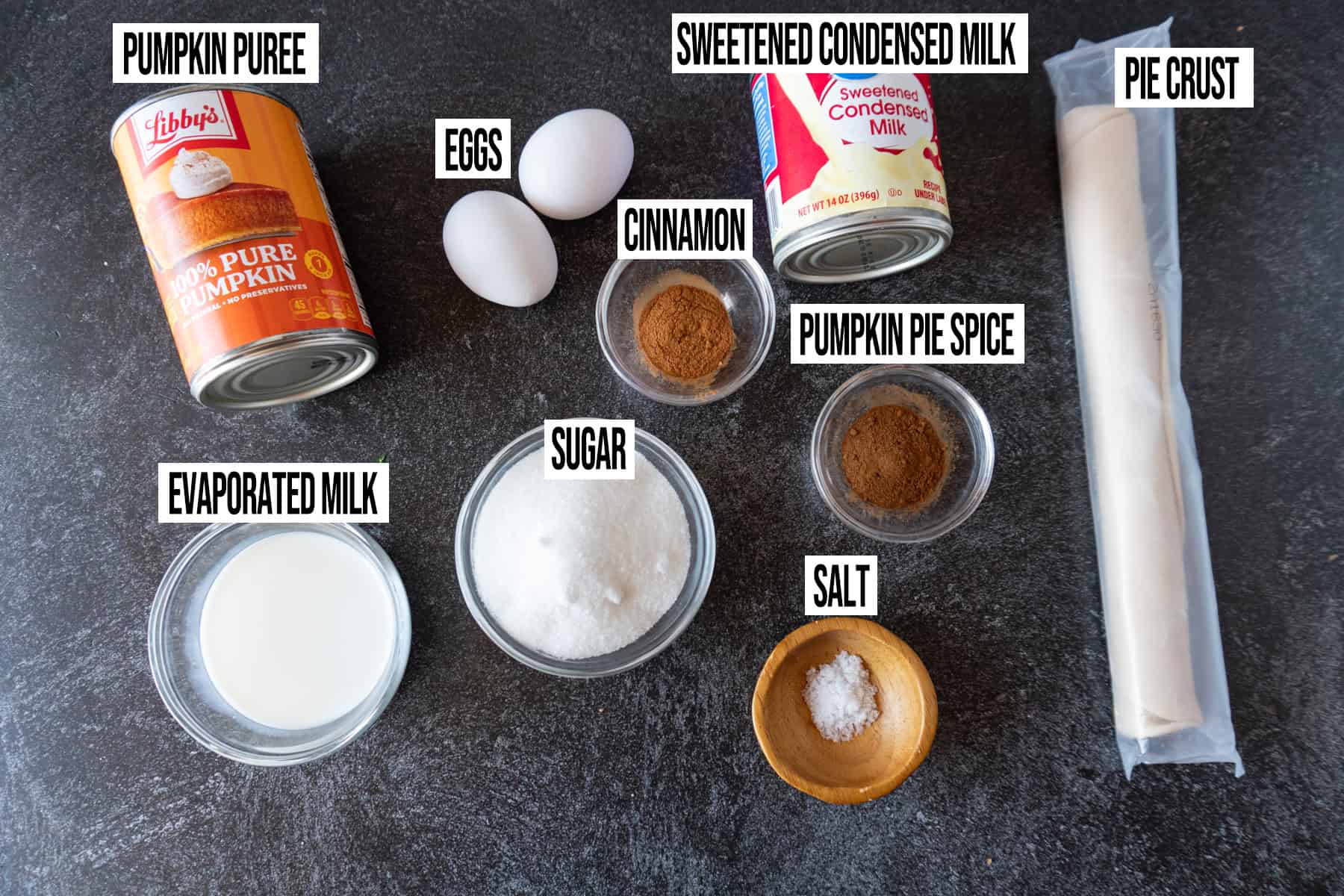 Pumpkin Pie with Sweetened Condensed Milk ingredients laid out and in individual bowls and labeled.