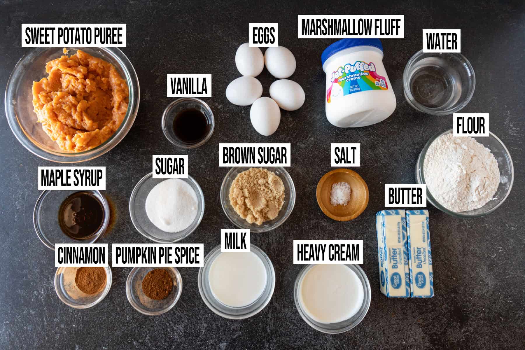 Sweet Potato Pie ingredients laid out and in individual bowls and labeled.
