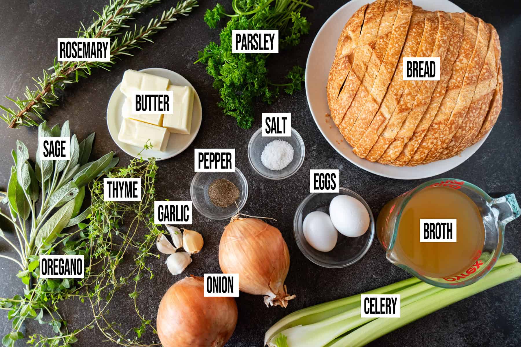 Thanksgiving dressing recipe ingredients laid out and in individual bowls and labeled.